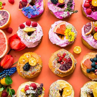 small sweet dessert donuts with orange background