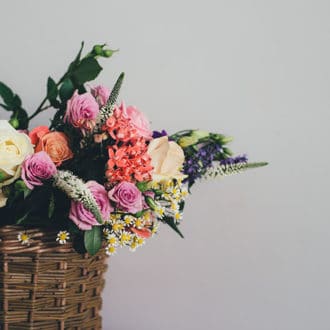 wicker basket filled with floral arangement
