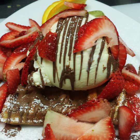 Nutella crepes with ice cream and fresh strawberries