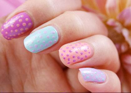 Pink purple and blue polkadot nail design