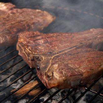 Steak grilling on barbecue