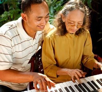 elderly-teaching-piano