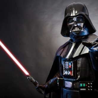 Darth Vader holding a lightsaber