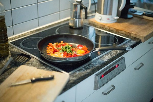 Pan on stove cooking vegetables