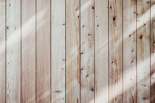 Light brown timber fencing planks