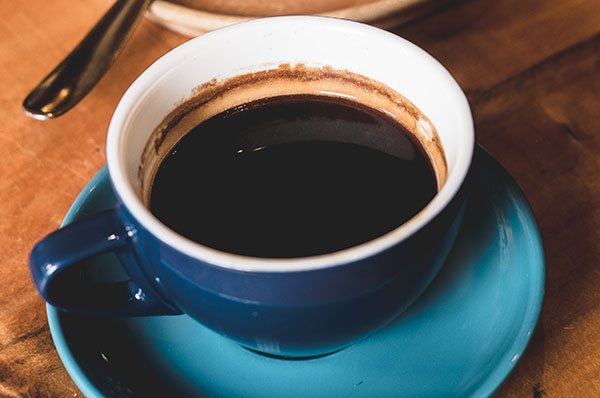 black coffee in a blue mug