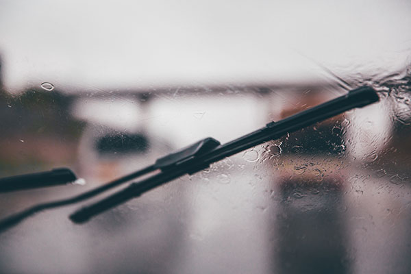 windscreen wiper across rainy windscreen