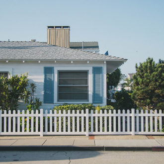 House with timber picket fence