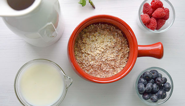 Bowl of oats with milk and fruit