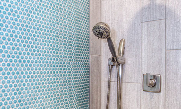 Shower head and blue tiles