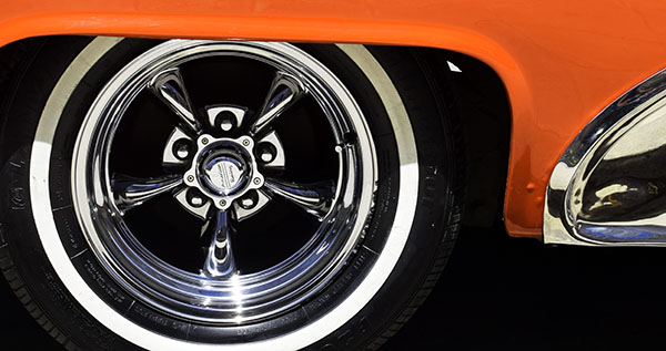 Car tyres on orange vehicle