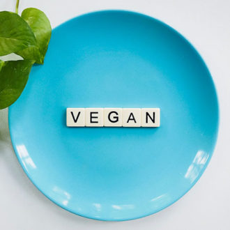 Blue plate with letters spelling vegan