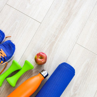 flooring with gym bag accessories shoes and snack