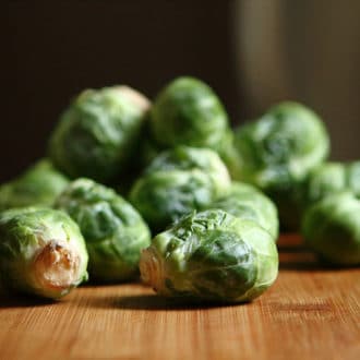 Pile of green brussel sprouts on table