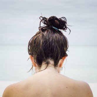 Girl with hair and skin exposed