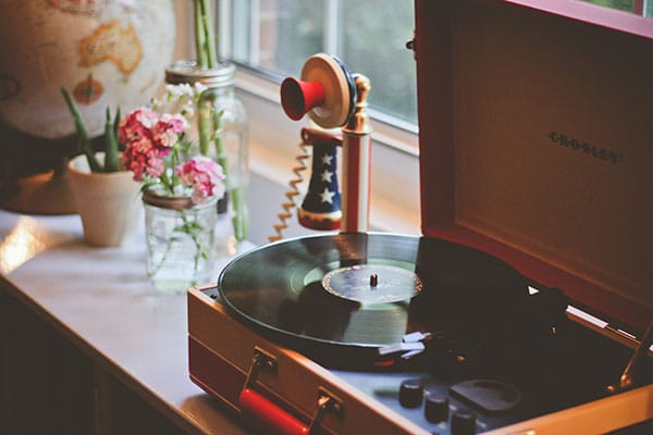table with record player and flowers decor