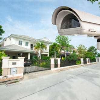 House on street with external home security camera