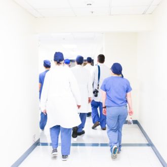 Nurses walked down a hallway
