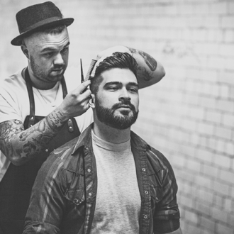 Man getting haircut in black and white
