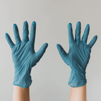 Two hands raised above head in blue gloves