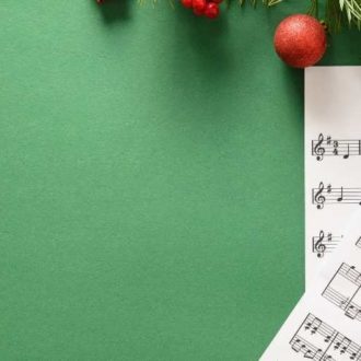 Christmas Sheet Music on Green Background
